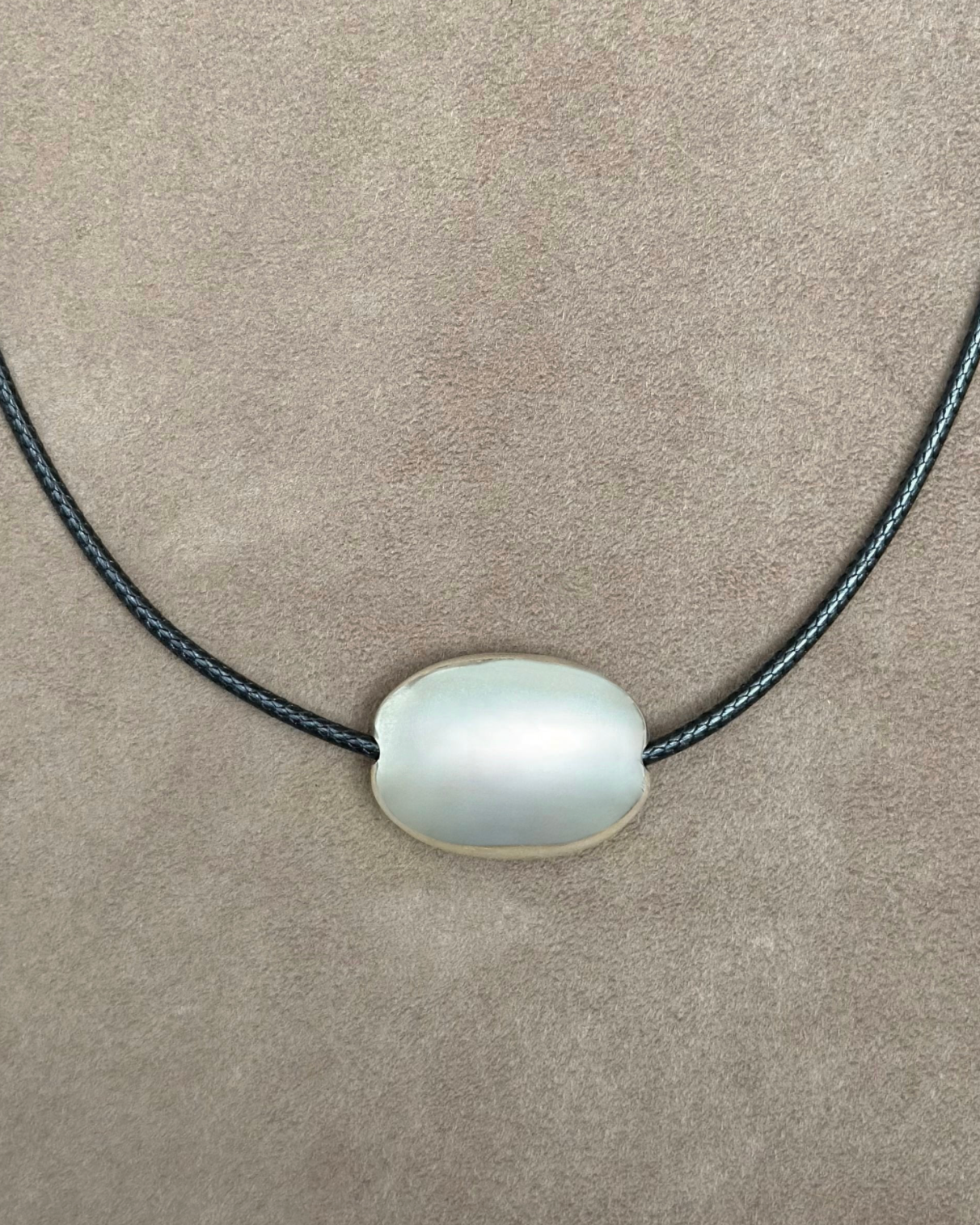 Small silver oval cord necklace